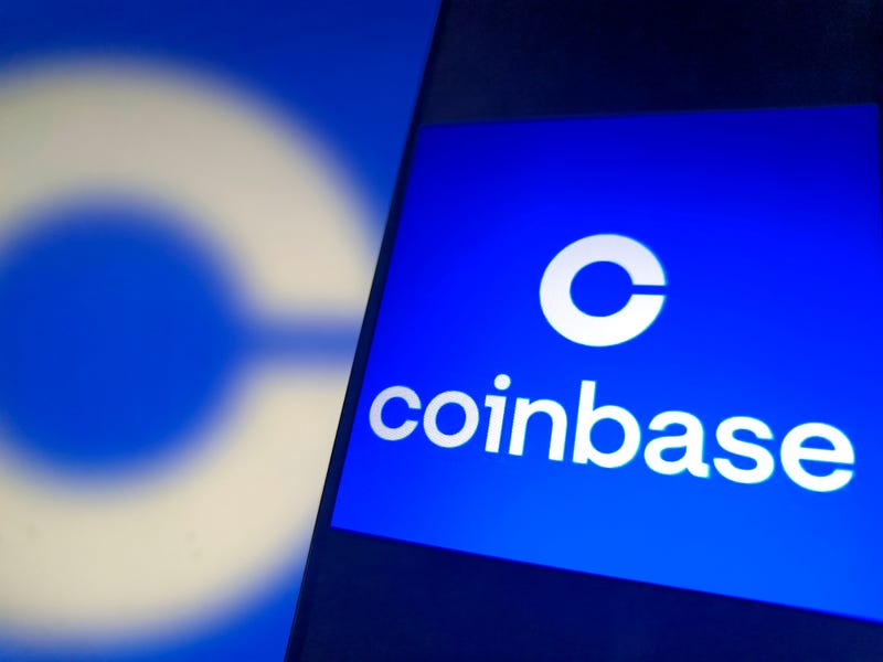  An illustration shows Coinbase logo in a smartphone 