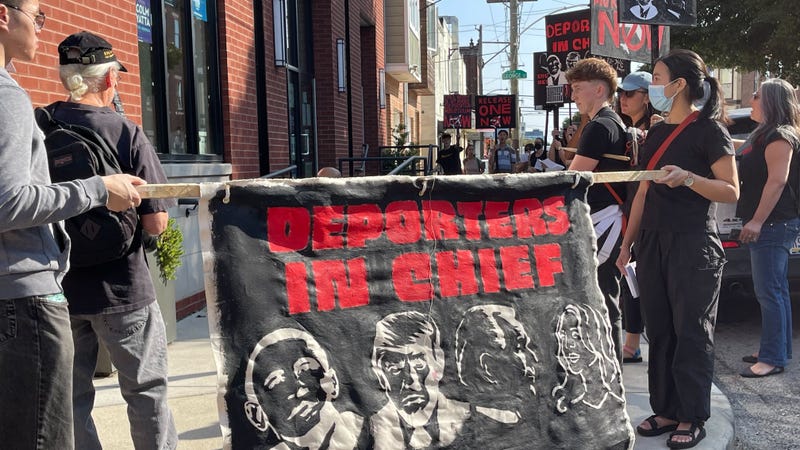 Immigration advocates protest outside of a Harris-Walz campaign office in Brewerytown on Monday, Sept. 9.