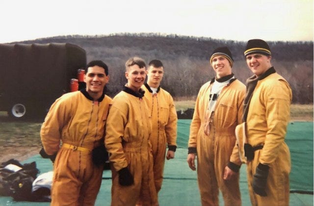 Col. Drew Morgan, center, a member of USMA Class of 1998, is pictured during his time as a member of the West Point Parachute Team
