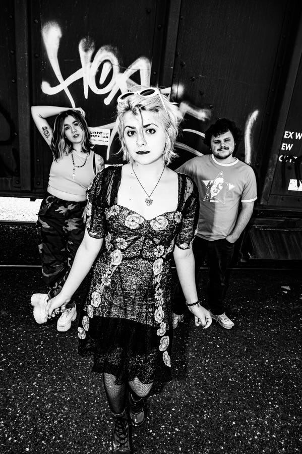 Seattle three-piece band pose in black and white