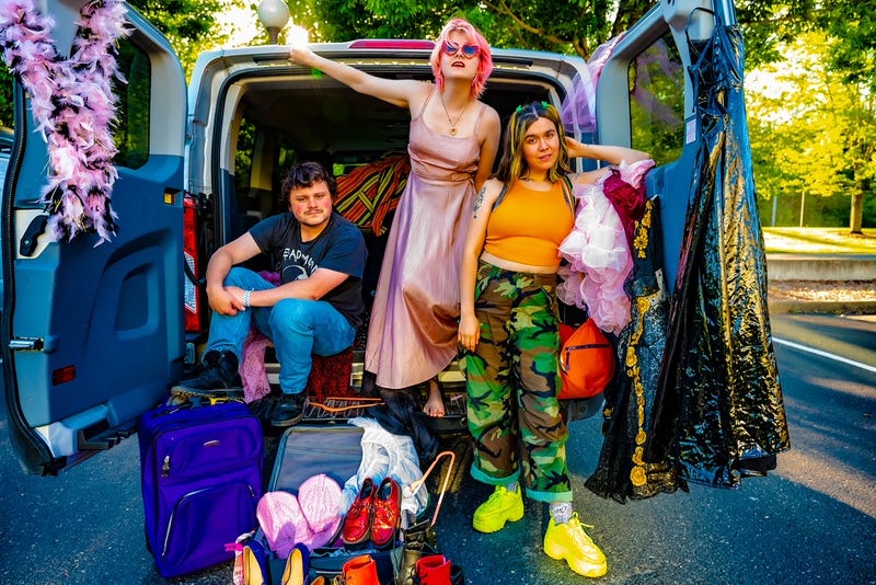 Seattle three-piece band Skating Polly pose inside the back of their ultra colorful tour van.