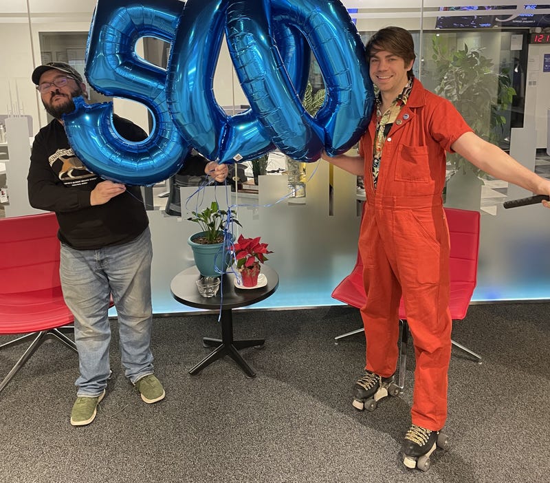 skater with balloons that spell out "500"