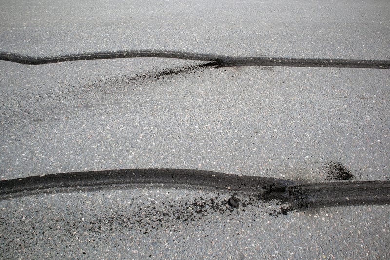 car tire skid marks on road