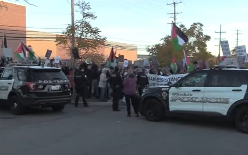 Police officers with protestors