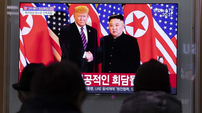 People watch a TV live broadcast on top leader of the Democratic People's Republic of Korea (DPRK) Kim Jong Un meeting with U.S. President Donald Trump in Seoul, South Korea, Feb. 27, 2019. 