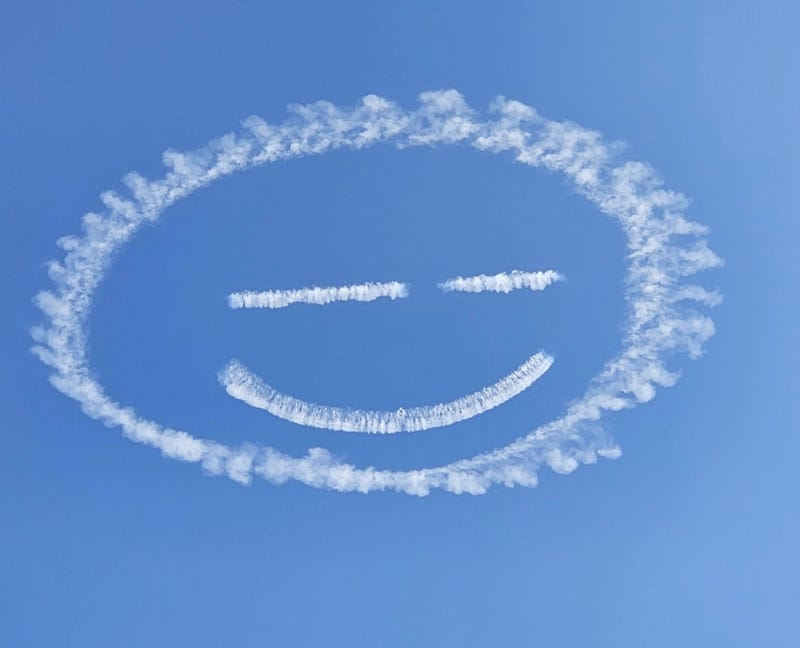 A smiley face, one of many designs by skywriter and pilot Nathan Hammond