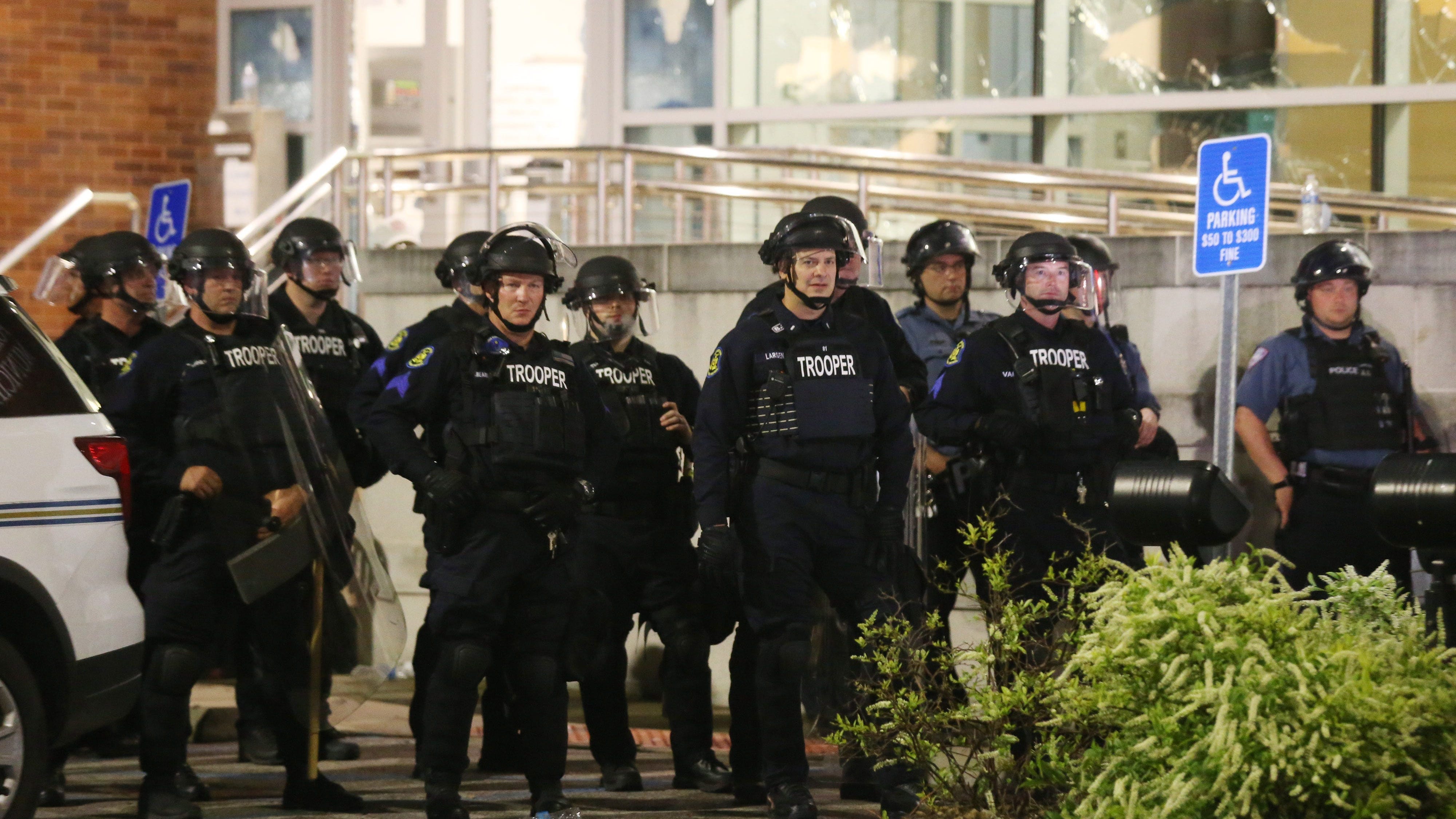 Police say 7 officers injured; Bricks thrown, fireworks shot at police after protest in Ferguson