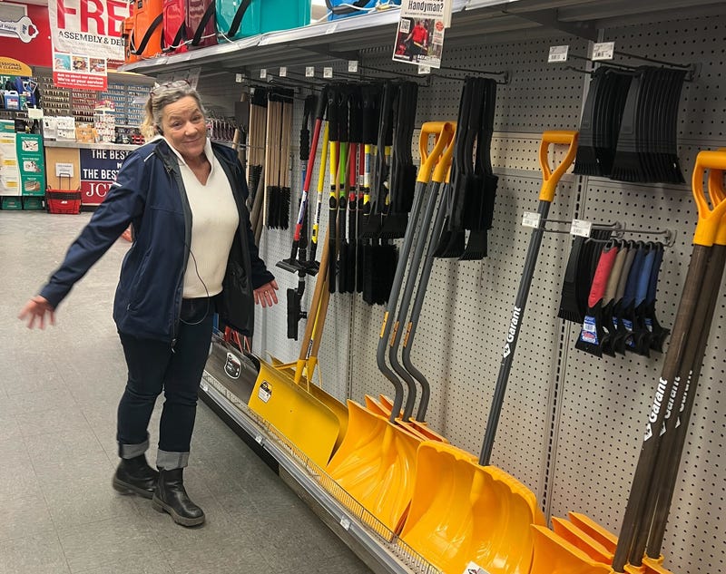 Kelly Hayward in front of shovels