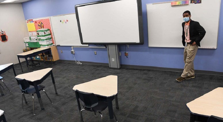 GCS Administrative Assistance Cameron Brice overlooking a socially distanced classroom at A.J. Whittenberg Elementary