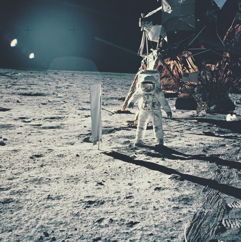 Edwin 'Buzz' Aldrin standing next to the Solar Wind Composition experiment