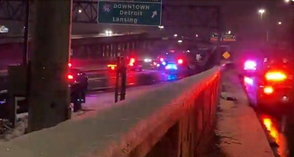 Police on the scene where a body was found along the Southfield Freeway on Jan. 23, 2023.