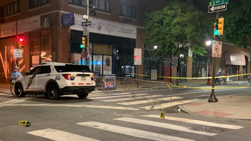 Philadelphia police are shown at Third and South streets at the beginning of their investigation into Saturday's mass shooting.