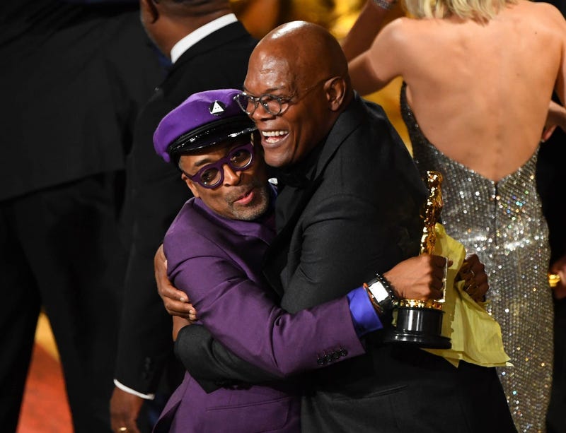Samuel L. Jackson hugs Spike Lee after his Best Adapted Screenplay award at the 2019 Oscars