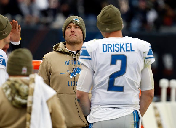 Matthew Stafford hangs on the sideline with backup Jeff Driskel. 