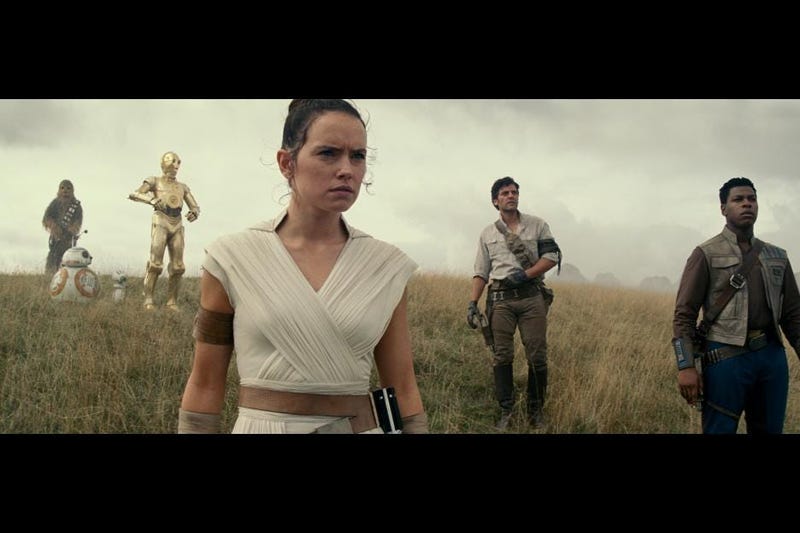 Daisy Ridley, center, co-stars with John Boyega and Oscar Isaac in Star Wars: The Rise of Skywalker