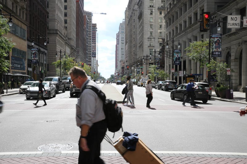 Pedestrians cross Broad Street in Center City.