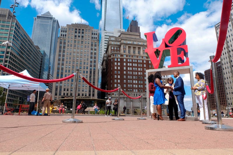 Claire Louis and Tyhim Hawkins get married at Love Park.