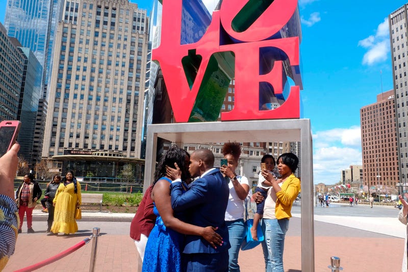 Claire Louis and Tyhim Hawkins get married at Love Park.