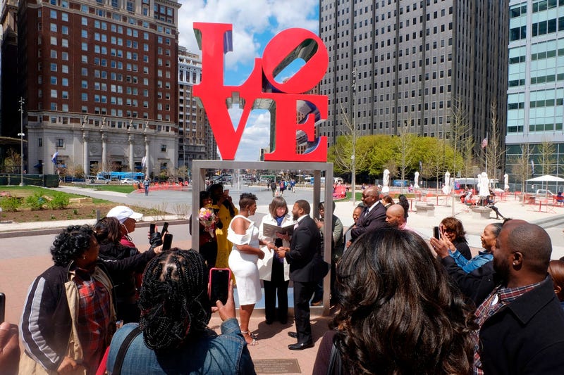 Claire Louis and Tyhim Hawkins get married at Love Park on April 10, 2019.