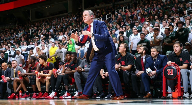 Head coach Steve Pikiell of the Rutgers Scarlet Knights gives instructions to his players from the bench in the first half against the Michigan State Spartans at Breslin Center on February 20, 2019 in East Lansing, Michigan.
