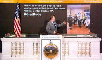 In this image taken from video provided by the New York Stock Exchange, Tommy Gannon, Assistant Supervisor, Facilities, rings the opening bell at the NYSE. (New York Stock Exchange via AP)