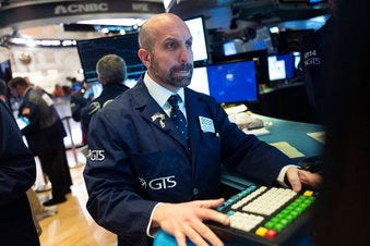 James Denaro monitors stock prices at the New York Stock Exchange, Wednesday, Feb. 26, 2020. (AP Photo/Mark Lennihan)