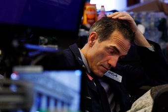Trader Gregory Rowe prepares for the day's activity on the floor of the New York Stock Exchange, Monday, March 9, 2020. (AP Photo/Richard Drew)