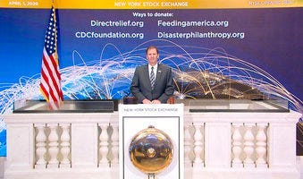 In this photo taken from video provided by the New York Stock Exchange, NYSE Security Director Gregory Crane rings the opening bell at the NYSE on Wednesday, April 1, 2020. (New York Stock Exchange via AP)