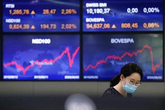 A currency trader watches monitors at the foreign exchange dealing room of the KEB Hana Bank headquarters in Seoul, South Korea, Monday, June 8, 2020. (AP Photo/Ahn Young-joon)