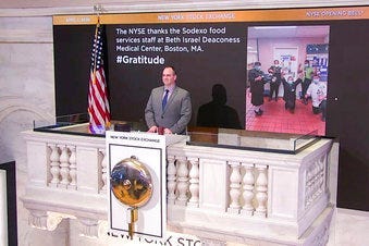 In this image taken from video provided by the New York Stock Exchange, Tommy Gannon, Assistant Supervisor, Facilities, rings the opening bell at the NYSE. (New York Stock Exchange via AP)