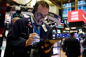 Trader Gregory Rowe works on the floor of the New York Stock Exchange, Monday, Feb. 24, 2020. (AP Photo/Richard Drew)