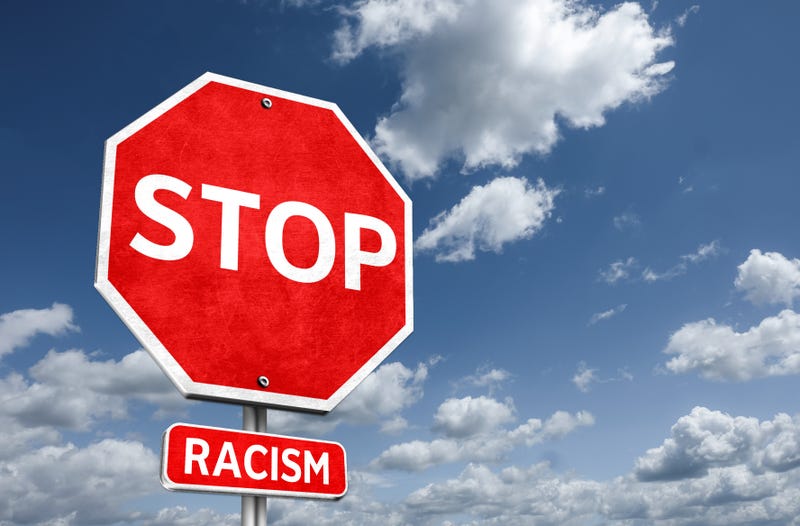 STOP RACISM - road sign illustration message