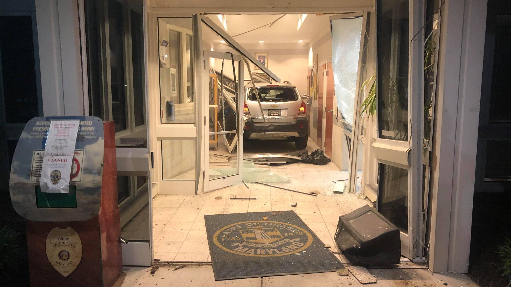 WATCH: Man’s vehicle plows into police station lobby