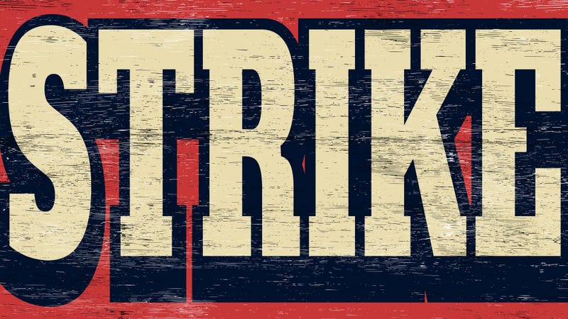 Aged and worn strike sign on wood