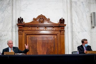 Chairman Sen. Ron Johnson, R-Wis., left, accompanied by Ranking Member Sen. Gary Peters., right, speaks as the Senate Homeland Security and Governmental Affairs committee meets on Capitol Hill. (AP Photo/Andrew Harnik)