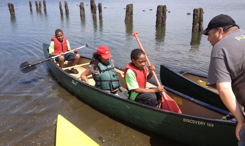 Kids kayaking at NYC Parks summer camp