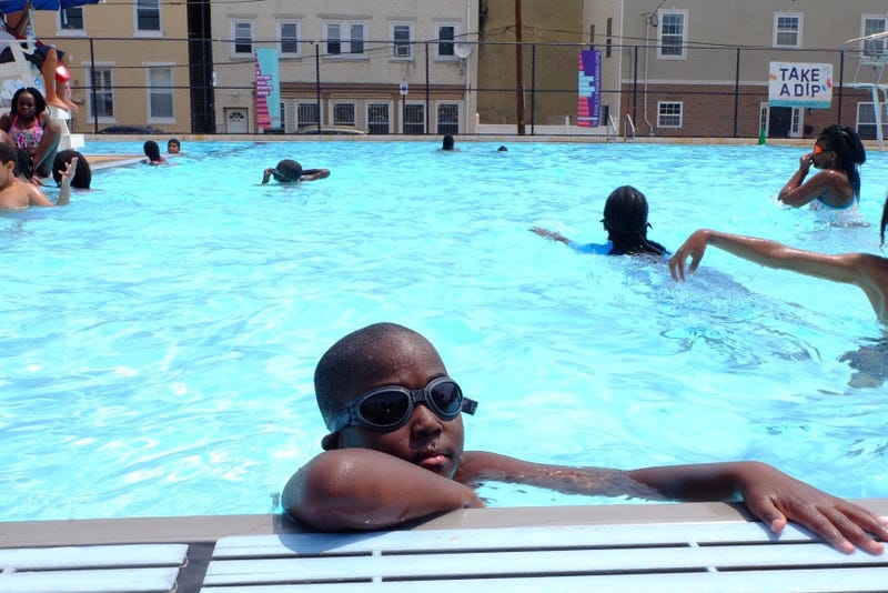 A child swimming in a Philadelphia pool.