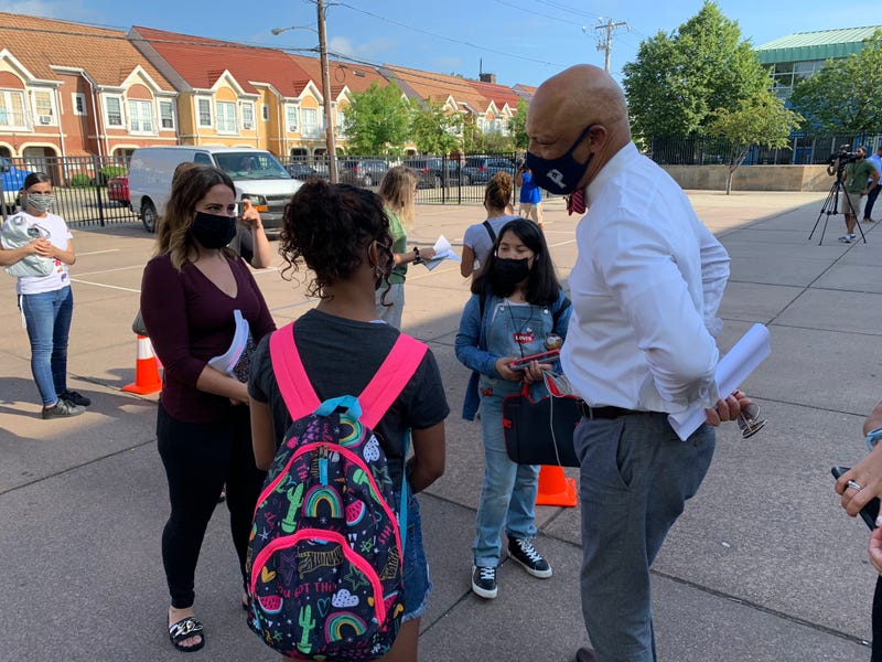 Superintendent William Hite greets students on the first day of summer classes. 