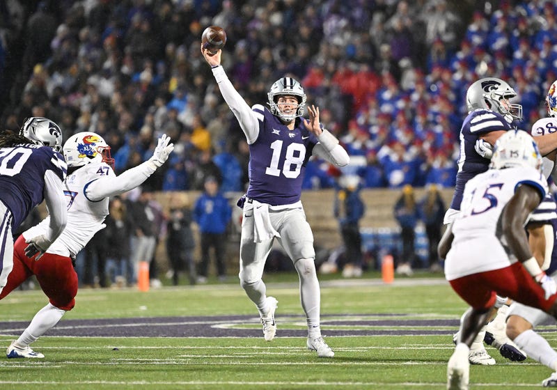 MANHATTAN, KS - NOVEMBER 26: Quarterback Will Howard #18 of the Kansas State Wildcats throws a pass against the Kansas Jayhawks during the first half at Bill Snyder Family Football Stadium on November 26, 2022 in Manhattan, Kansas.
