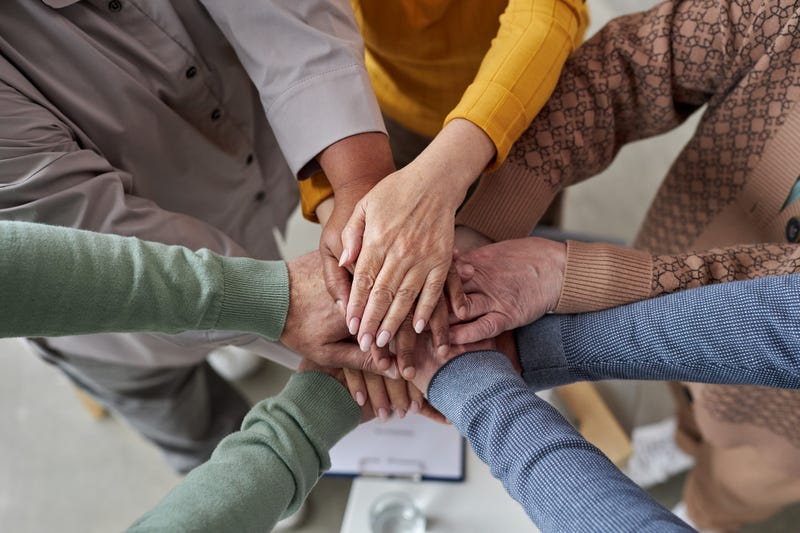 support group showing hands joining