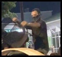  The male in the black shirt is suspected of arson and vandalism over several hours on July 25, 2020