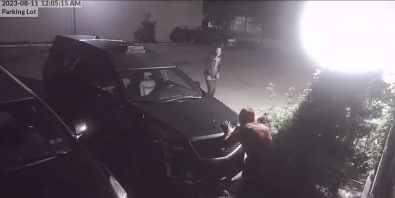 Screenshot of the night when a Detroit Police Officer was shot by suspects hiding behind a vehicle in parking lot outside of building
