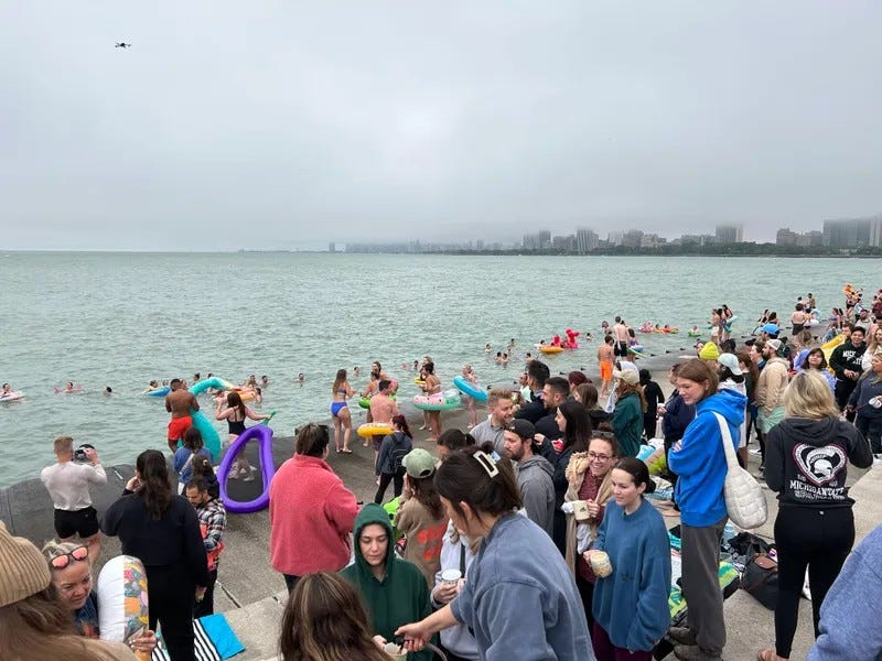 mass of swimmers along Lake Michigan