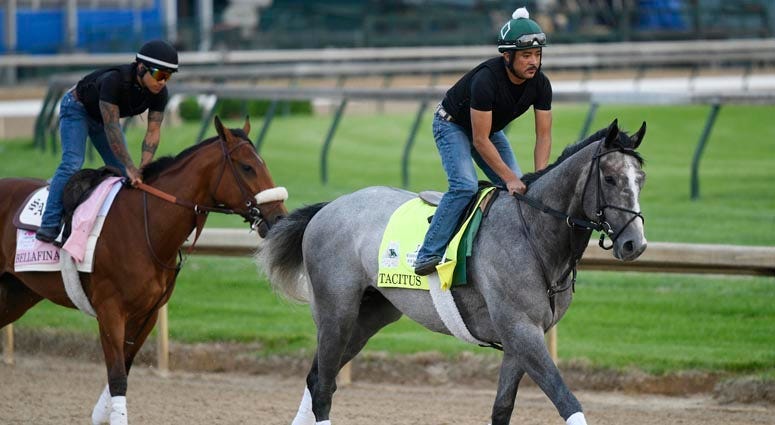An exercise rider works Kentucky Derby entry Tacitus during morning workouts at Churchill Downs on May 1, 2019, in Louisville, Kentucky. 