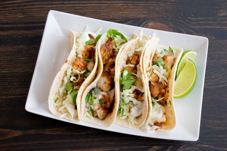 multiple tacos on a plate