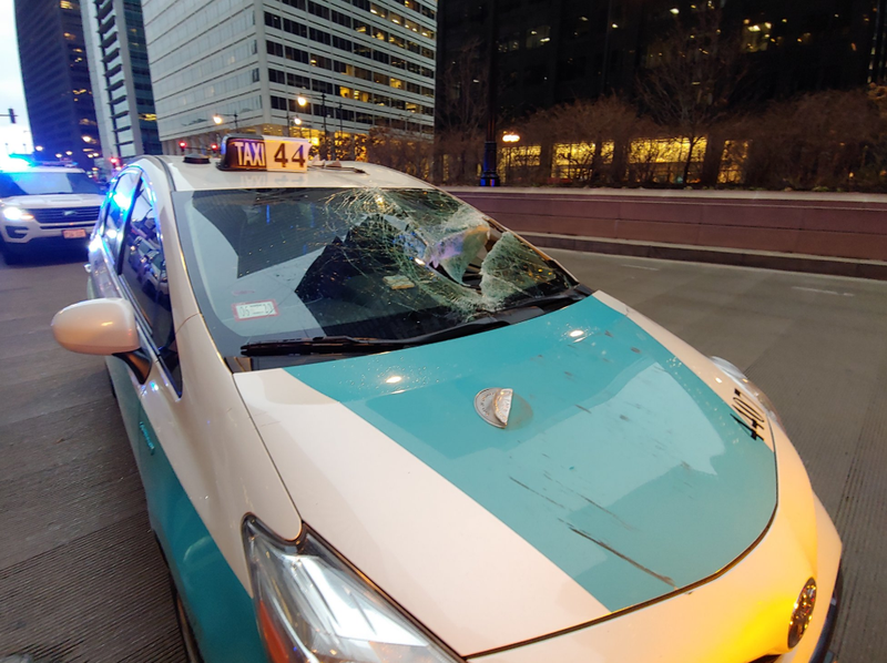 A piece of falling wood injured a driver Wednesday morning near Willis Tower amid a high wind warning in the Chicago area.