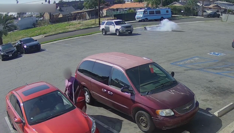 security footage of teddy bear on fire in parking lot