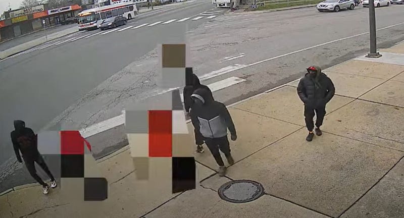 Surveillance video shows four males surround Devin Weedon and a friend (blurred).