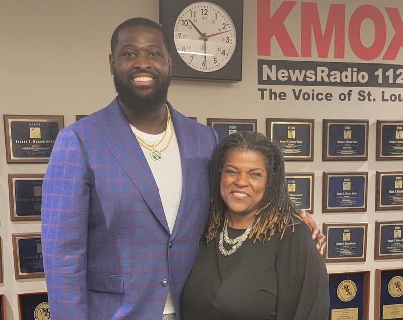 Carol Daniel stands with Terron Armstead.