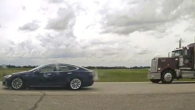 Tesla driver, 20, charged after found asleep at wheel of self-driving car traveling over 90 mph